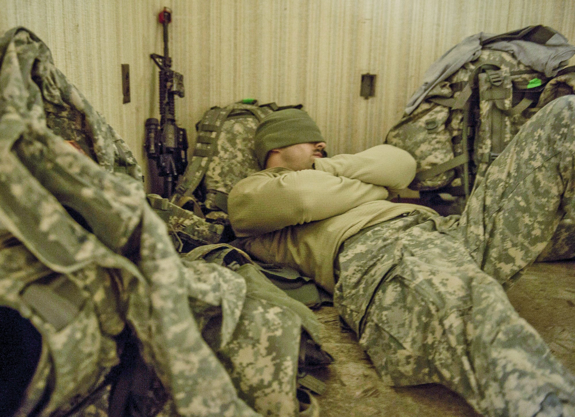 Sgt. Ryan Blount, 27th Brigade, New York Army National Guard, rests in a hallway after a full day of field training, before heading back out Jan. 16, 2015, at Alexandria International Airport, La. The exercise was an eight-day combined military training event designed to prepare Airmen and soldiers to respond to worldwide crises and contingencies. People can lessen the effects of sleep deprivation during long operations by taking precautions such as allowing Soldiers seven to nine hours of sleep regularly for five to seven days before the mission and allowing Soldiers to sleep who are not mission essential at the moment, according to Col. Vincent Mysliwiec, a sleep medicine specialist with 121st Combat Support Hospital, Brian Allgood Army Community Hospital in Yongsan, South Korea. (U.S. Air Force photo by Senior Airman Cliffton Dolezal)